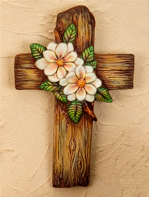 Ceramic mold wooden cross with floral design on a beige wall example.