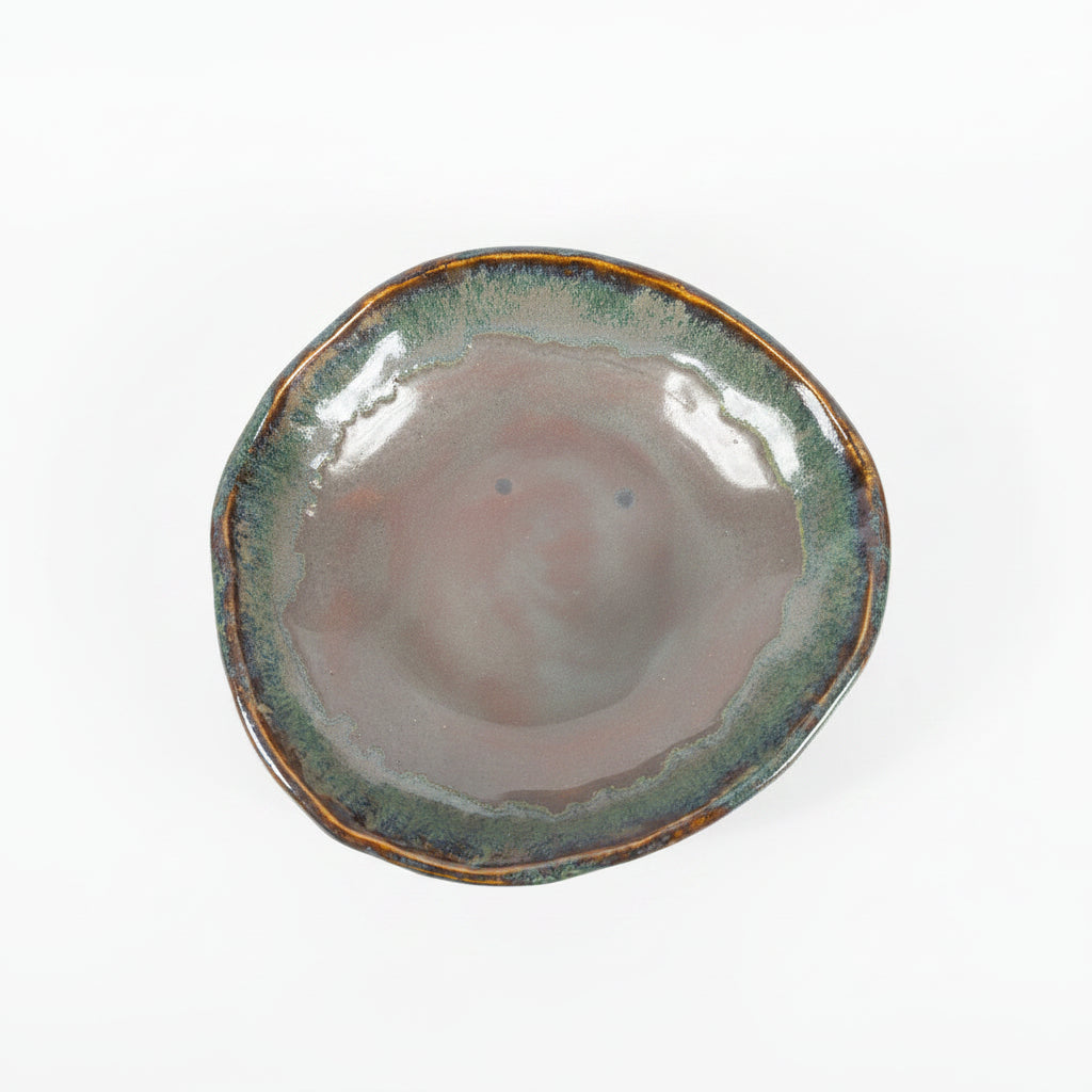 Ceramic dish with a textured surface on a dark background