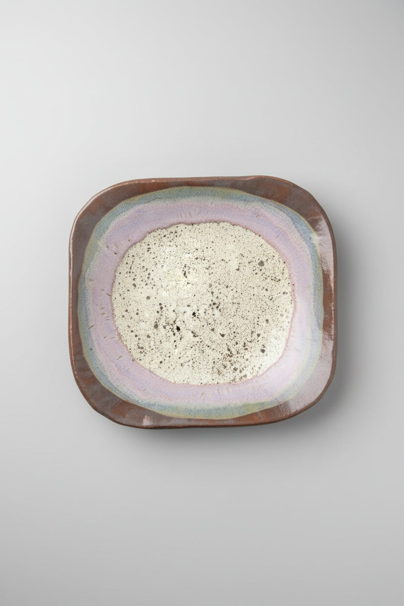 Ceramic plate with a textured surface on a dark background